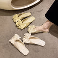 French-style slip-on mules with bow detail, new for summer 2025. unique, fairy-like, flat, retro sandals