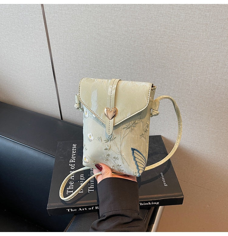 Cross-border embroidered canvas bag women's summer 2025 new fashion niche messenger bag Korean version Internet celebrity popular mobile phone bag