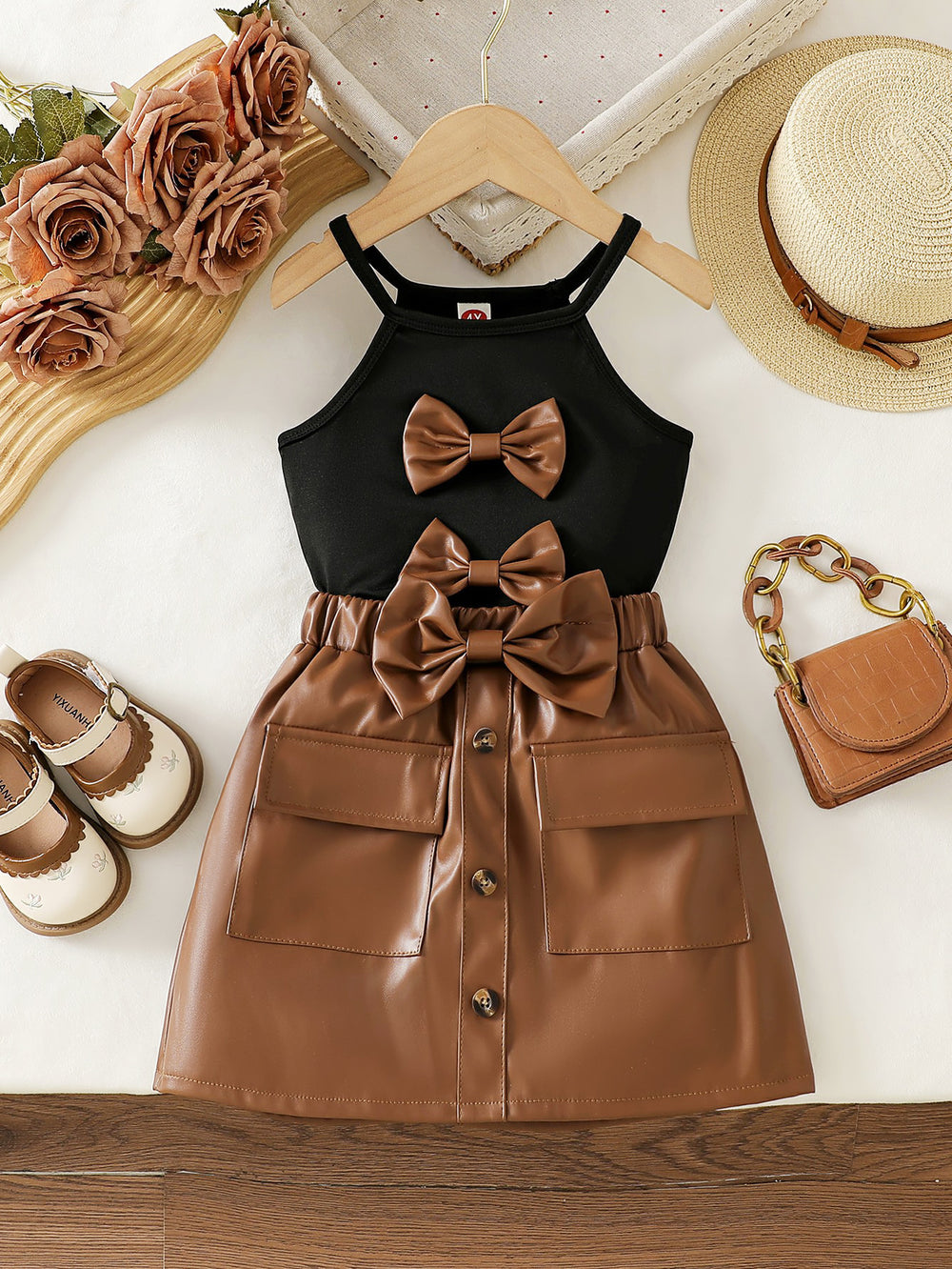 cross-border girls' fashion bowknot solid color camisole + pu leather skirt two-piece set