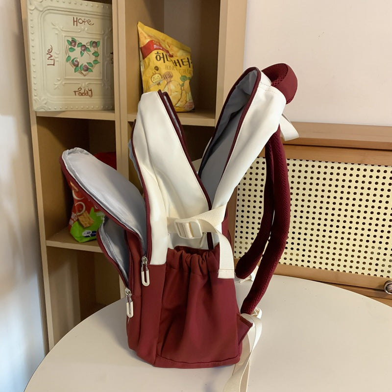 Backpack New fashion junior high school college student schoolbag Large capacity lightweight backpack Simple texture backpack