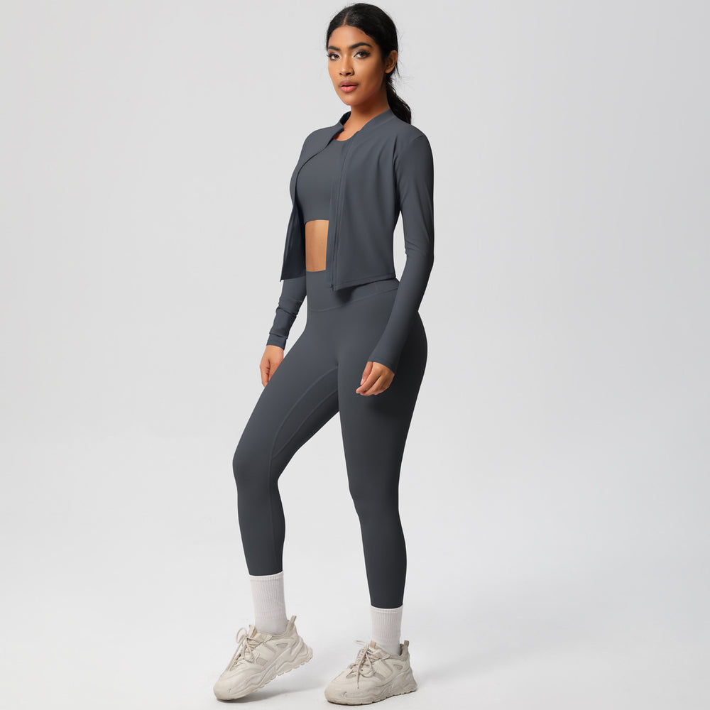 High-waisted, form-fitting yoga pants, a barely-there feel, quick-drying outer layer, and a long-sleeved tee – a women's three-piece activewear set perfect for running and workouts