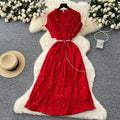 French-inspired v-neck floral chiffon dress with flared sleeves, tie waist, and a figure-flattering, vintage-inspired silhouette