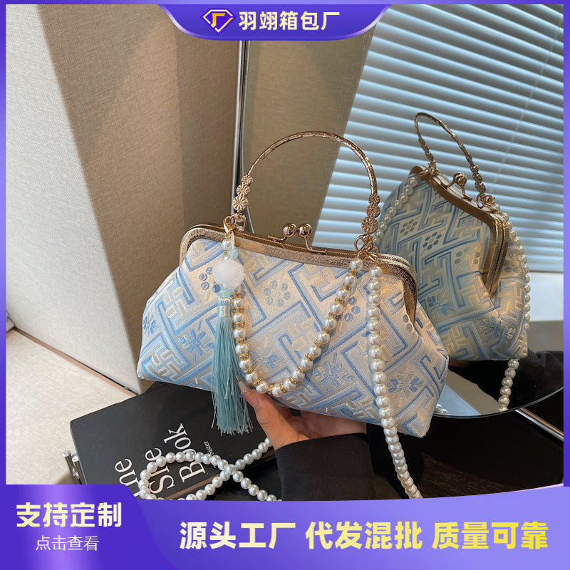 Cross-border new Chinese style national style hand bag women's summer 2025 new niche messenger bag Korean version popular mouth gold bag