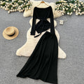 French chic autumn/winter outfit: asymmetrical tie-waist long sleeve knit top + high-waisted midi skirt