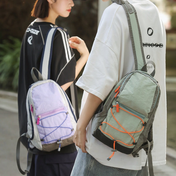 Outdoor casual backpack 2025 new cross strap niche high value backpack couple going out travel bag tide