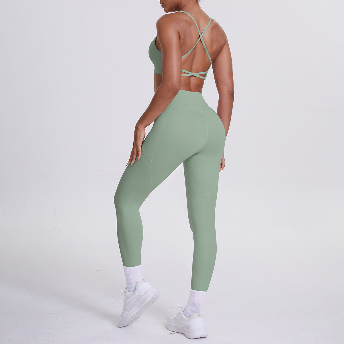 Spot European and American nude sports pocket trousers sexy suspenders sports beautiful back running fitness pants yoga suit set