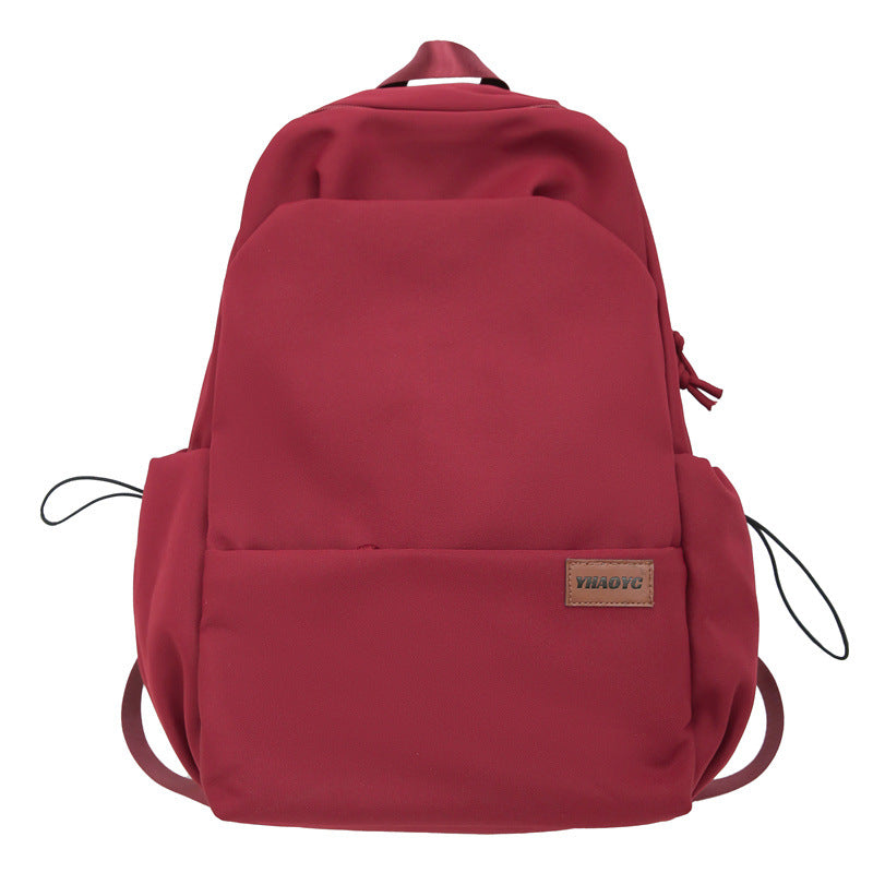 New solid color junior high school student large-capacity backpack male backpack schoolbag male college student business travel backpack