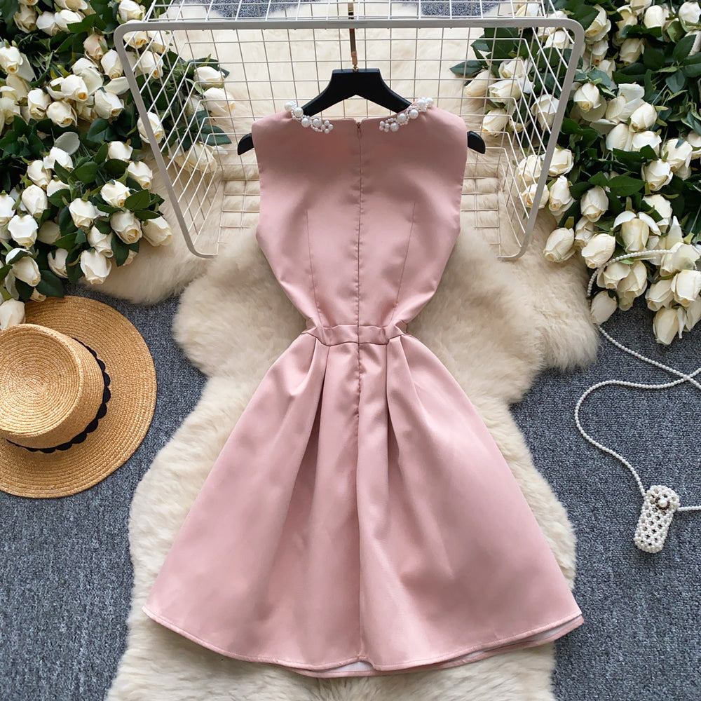 High-end, understated luxury beaded round neck sleeveless dress for women. perfect for summer, this french-inspired dress features a cinched waist, a-line silhouette, and a flattering, voluminous skirt. ideal as an elegant evening gown or special occasion