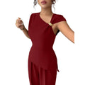 Women's elegant sleeveless fitted top with metal accents and asymmetrical hem, paired with loose straight-leg pants - 2-piece set