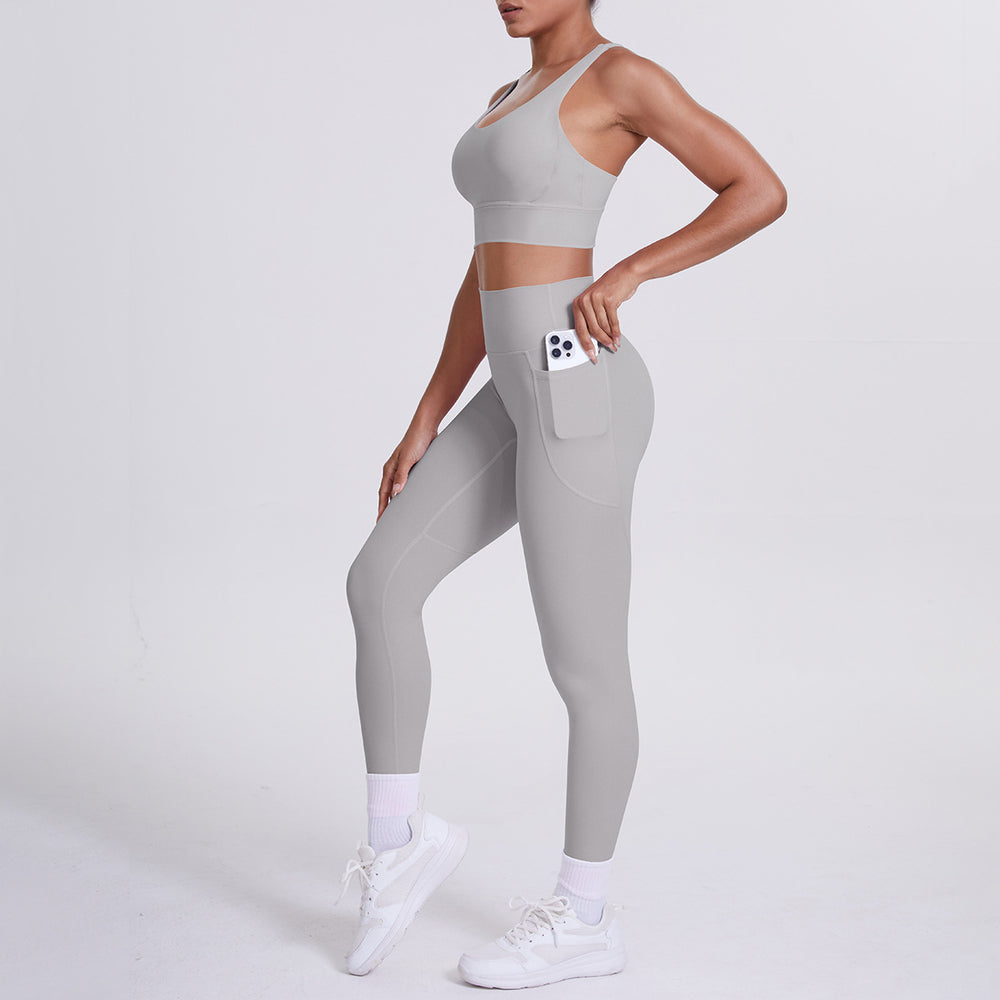 New arrival cross beautiful back cloud sense tight yoga suit suit women's high waist hip pocket sports fitness suit two-piece set