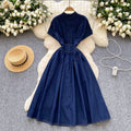 High-end women's dress:  summer collection - sophisticated deep v-neck, cinched waist, button-down, slim-fit, pleated casual denim dress