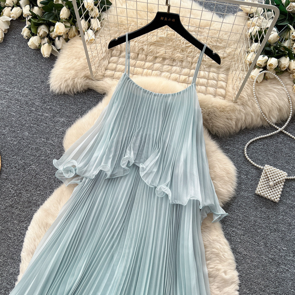 Vacation-style light blue camisole sleeveless dress for women, featuring a summer ruffle trim, high waist, slimming effect, and pleated fairy-length skirt