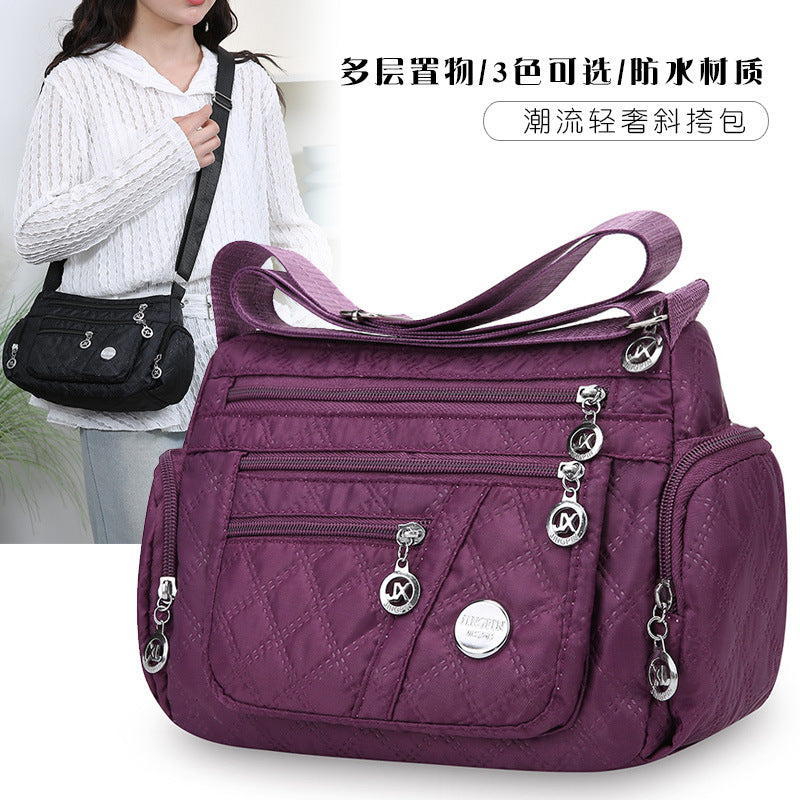 Outdoor casual versatile messenger bag women's large-capacity rhombus embroidery thread simple shoulder bag three-layer storage middle-aged women's bag