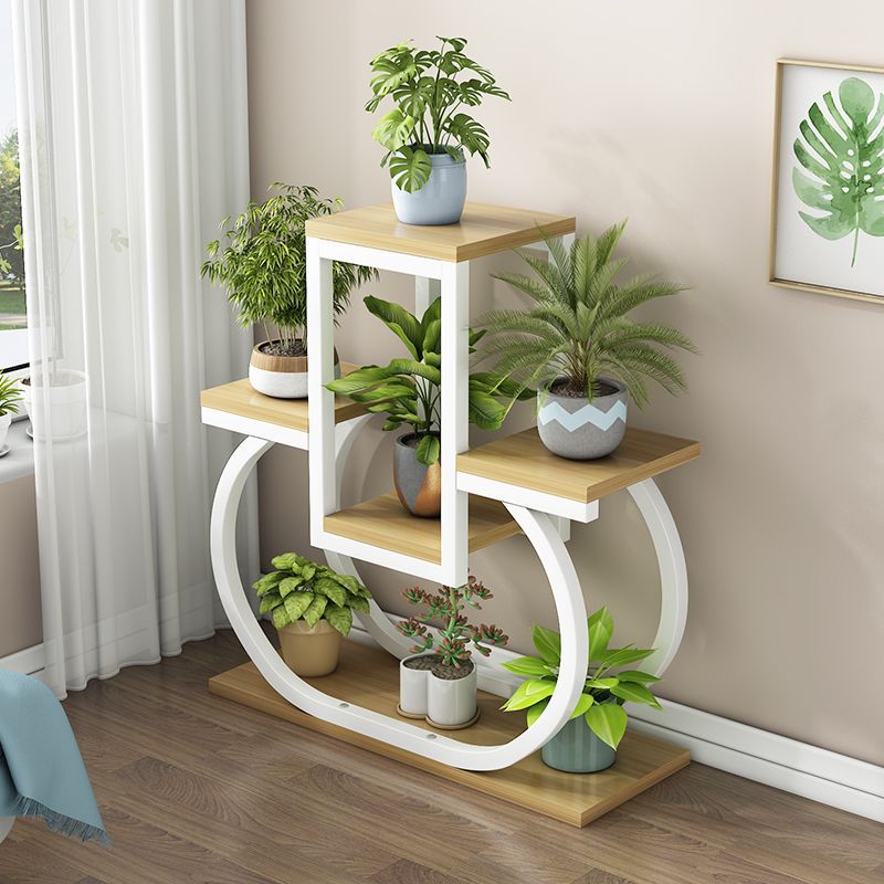 Creative iron art flower stand - freestanding, multi-tiered plant stand for balconies, living rooms, and home use - wall-mounted planter shelf
