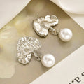 Wholesale faux pearl earrings - european & american cross-border retro fashion earrings - light luxury, high-end, unique, asymmetrical stud earrings for women