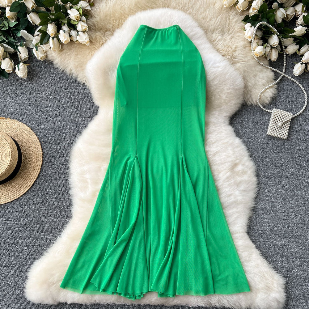 High-end, sophisticated, and effortlessly chic: this versatile midi skirt is perfect for the modern woman's commute. featuring a stylish design with elastic detailing, a figure-flattering fit, and a trendy mesh and fishtail hem, this skirt is a must-have