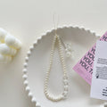 Minimalist pearl white heart bracelet with gauze bow and bear charm - phone lanyard accessory