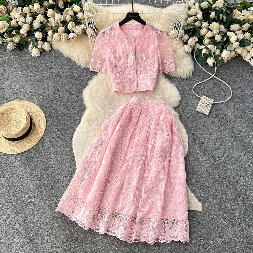 High-end, sophisticated, and feminine two-piece set for women. features a french-style lace crochet blouse with puff sleeves and a high-waisted, slimming midi skirt