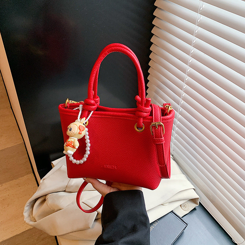 Foreign trade advanced sense hand carrying bucket bag 2025 summer simple and versatile shoulder bag trendy niche design messenger bag