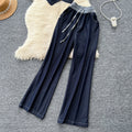 High-end women's summer outfit featuring a stylish v-neck sleeveless single-breasted top and a casual wide-leg pants two-piece set
