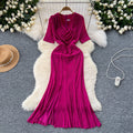 Elegant and alluring, this high-end, figure-hugging, mid-length mermaid gown features a plunging neckline, short sleeves, hot-fix rhinestone embellishments, and a daring slit. perfect for the sophisticated woman