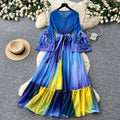Vacation-style purple floral print dress for women, spring long-sleeved high-waisted a-line dress with a cinched waist and ruffle hem maxi skirt