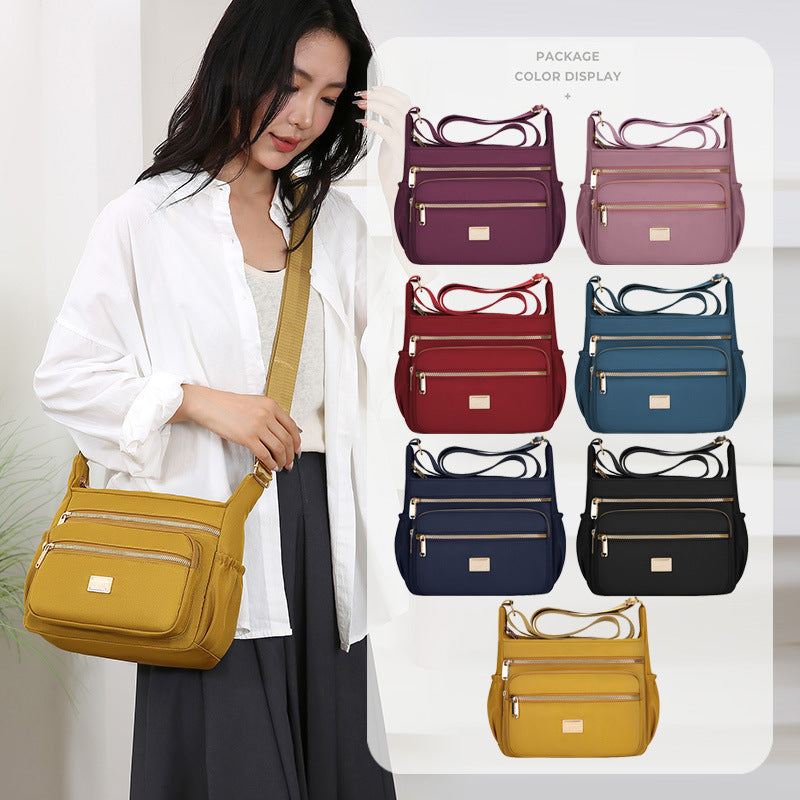 Women's bags are fashionable and simple, large-capacity messenger bags, multi-layer storage, travel shoulder bags, going out for commuting, middle-aged mother bags.