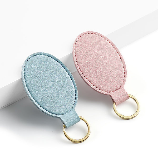 Cross-border pu leather keychain, fashionable and simple round leather buckle, logo leather pendant, men's and women's key rings.