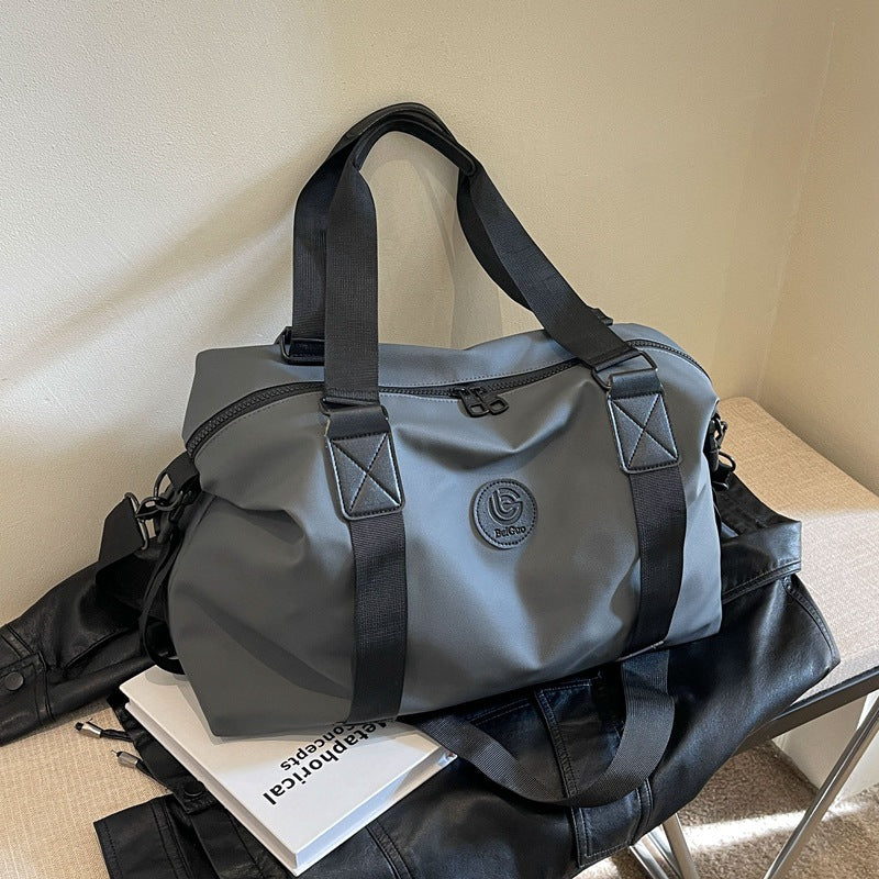 New travel bag women's travel portable hand luggage bag Korean version large-capacity messenger sports fitness bag travel bag