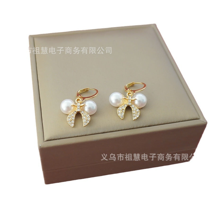 wholesale: a pair of trendy bow earrings. gold-plated bow tie earrings, perfect for everyday wear