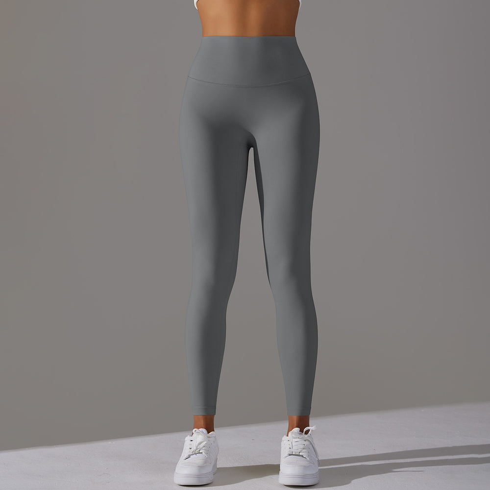 High-waisted, barely-there yoga pants for women, designed with a no-ride-up waistband for a seamless look. these figure-hugging, peach-shaped leggings offer a lift and a comfortable, stretchy fit, perfect for workouts and fitness activities. custom manufa