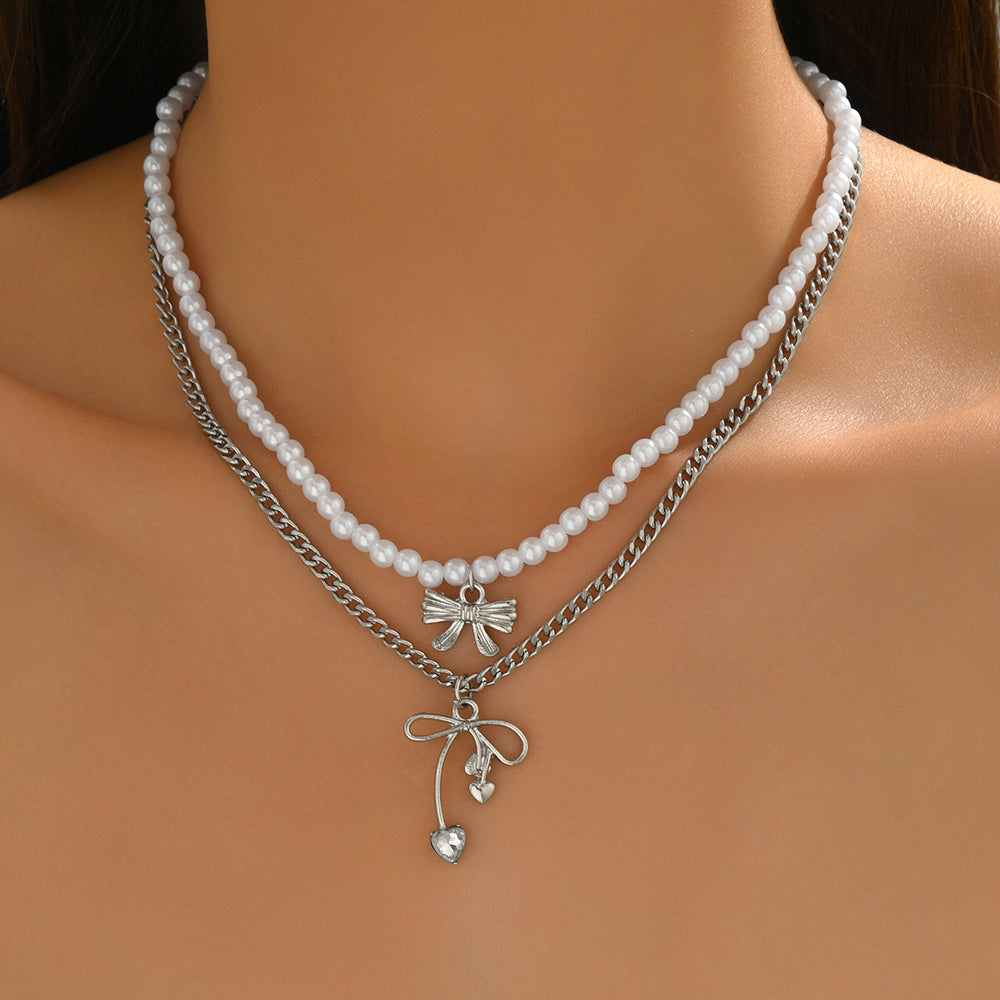 Sweater chain long wholesale european and american cross-border autumn and winter bow pendant stacking simple accessible luxury niche pearl necklace