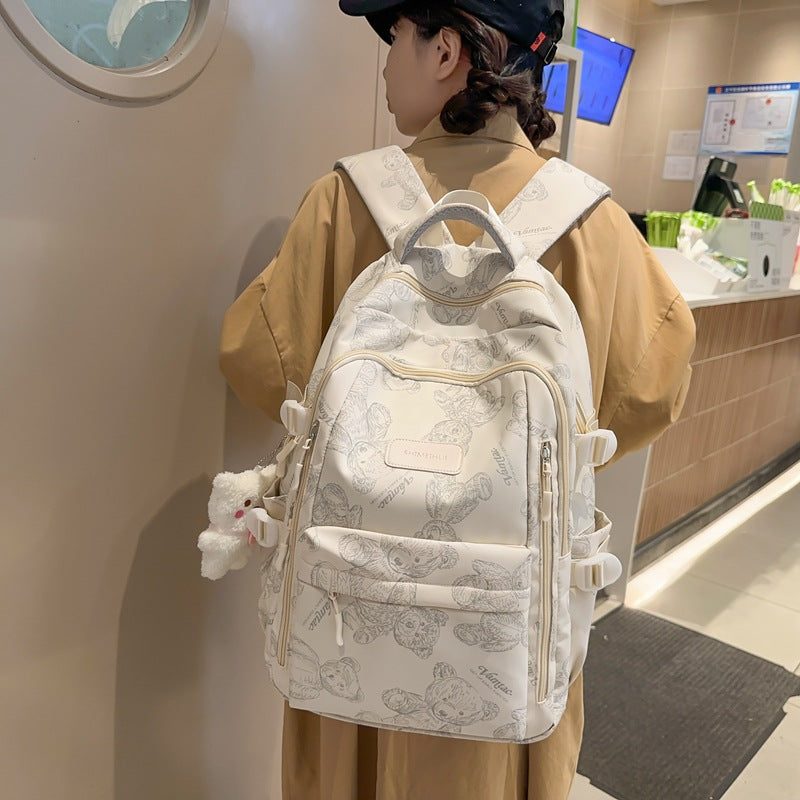 New high school and junior high school students large-capacity night reflective backpack travel backpack Japanese simple graffiti bear