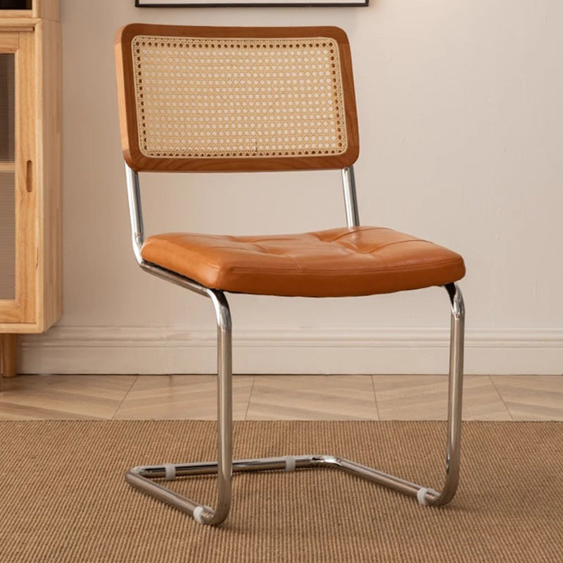 Rattan dining chair - luxury, high-end design with curved backrest - modern minimalist woven rattan chair