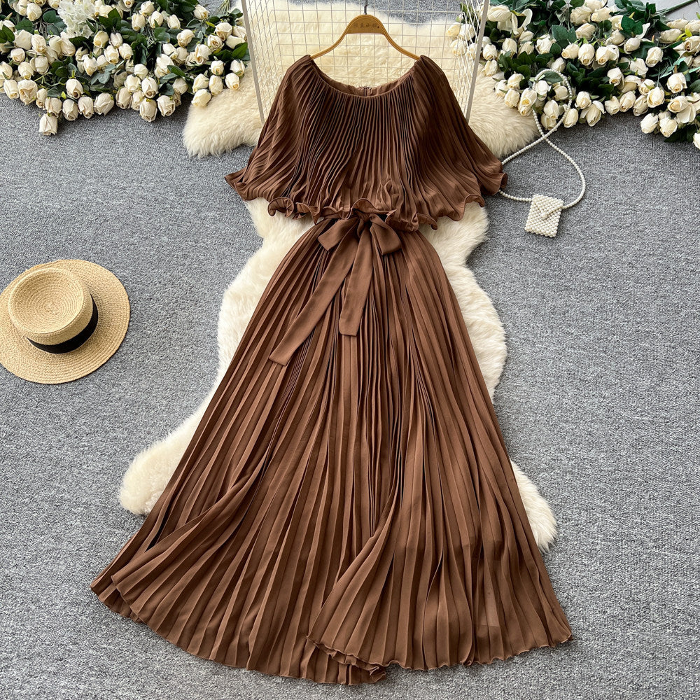 French-inspired pleated dress for women, featuring a bow tie, off-the-shoulder design, tie-waist, and flattering pleats for an elegant and sophisticated look