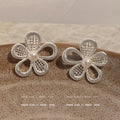 Silver needle korean style lace design hollow flower s family pearl stud earrings women's high-end earrings elegant stud earrings
