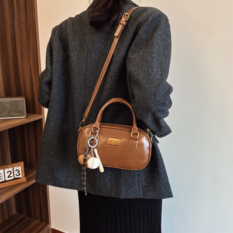 Spring new trend casual shoulder handle women's Korean version fashion commuter women's messenger bag versatile bowling bag