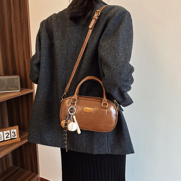 Spring new trend casual shoulder handle women's Korean version fashion commuter women's messenger bag versatile bowling bag