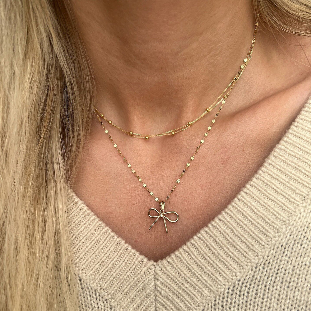 European and american cross-border fashion minimalist alloy bow pendant necklace, light luxury small multi-layered beaded chain necklace