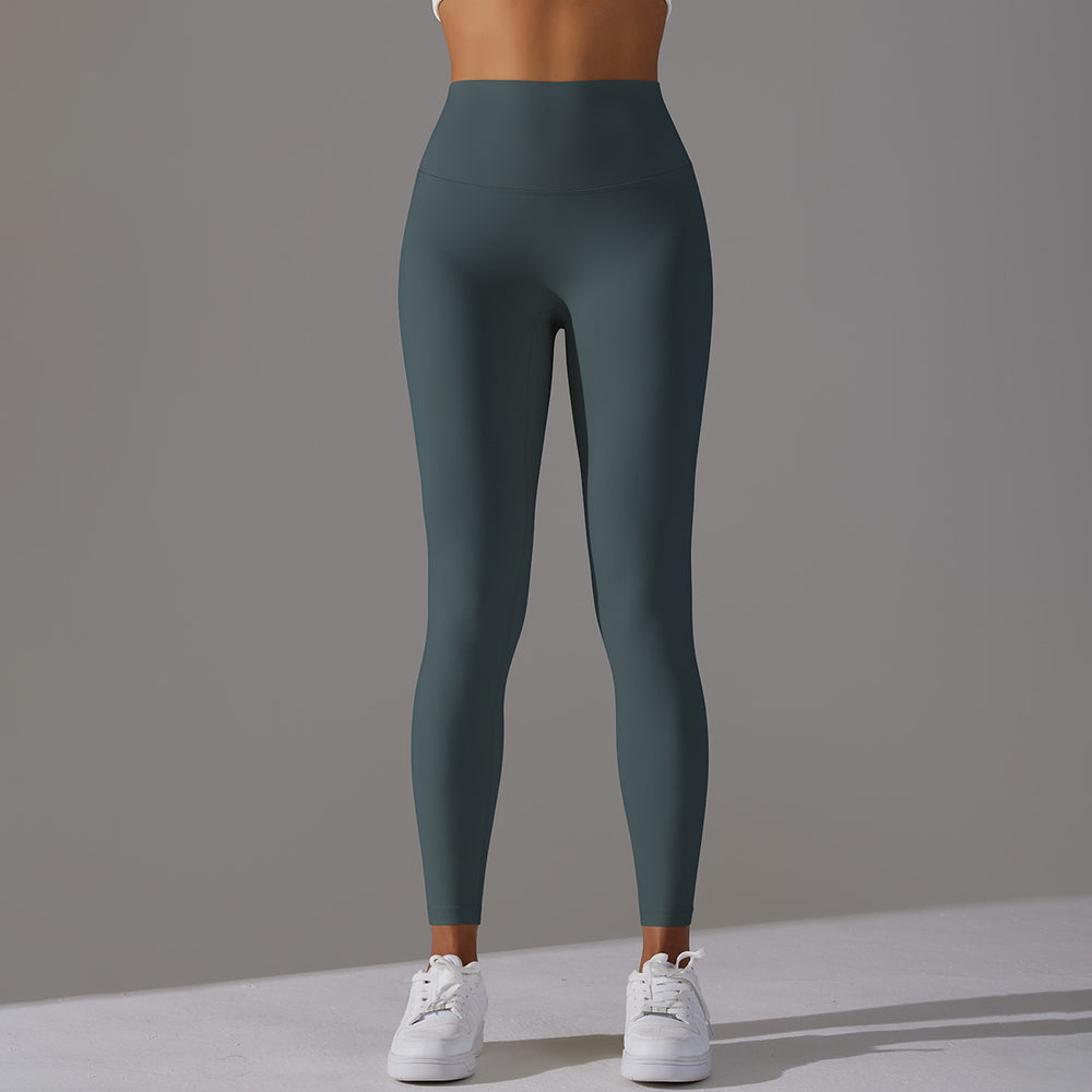 High-waisted, barely-there yoga pants for women, designed with a no-ride-up waistband for a seamless look. these figure-hugging, peach-shaped leggings offer a lift and a comfortable, stretchy fit, perfect for workouts and fitness activities. custom manufa