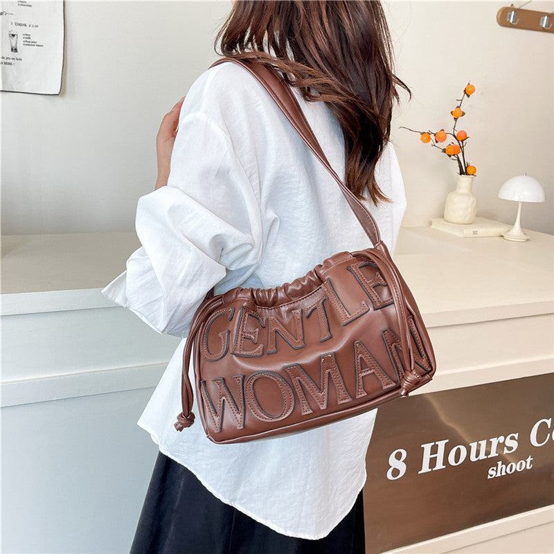 Thailand gentle woman drawstring bag women's 2026 new embossed letter shoulder bag trendy tote bag