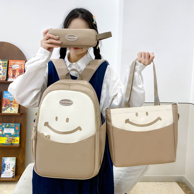Cute smiley face, primary and secondary school student schoolbag, simple and fashionable, large-capacity backpack, small and fresh, going out travel backpack.