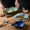 Japanese kiln-turned ceramic flavor dish stylish restaurant hotel oyster-shaped high-value dessert small dish dipping soy sauce dish