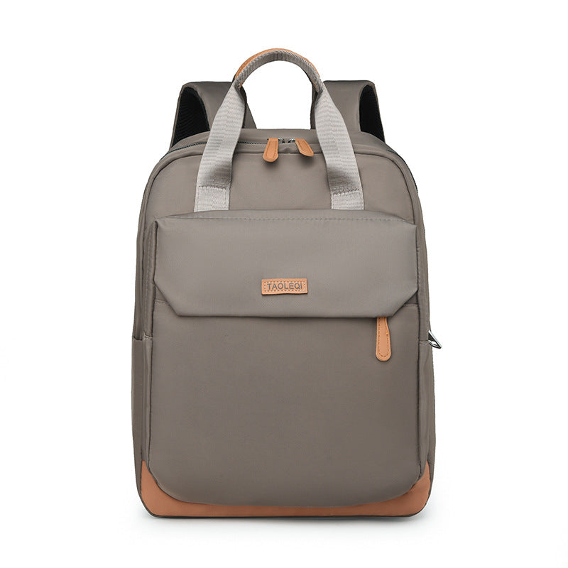 New large-capacity simple travel backpack, lightweight and trendy college student schoolbag, fashionable business commuter backpack.