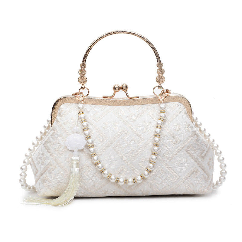 Cross-border new Chinese style national style hand bag women's summer 2025 new niche messenger bag Korean version popular mouth gold bag