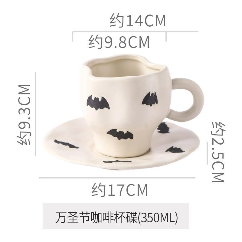 Creative halloween-themed ceramic cup and saucer set, featuring an irregular design with pumpkin and bat motifs. perfect for coffee or tea