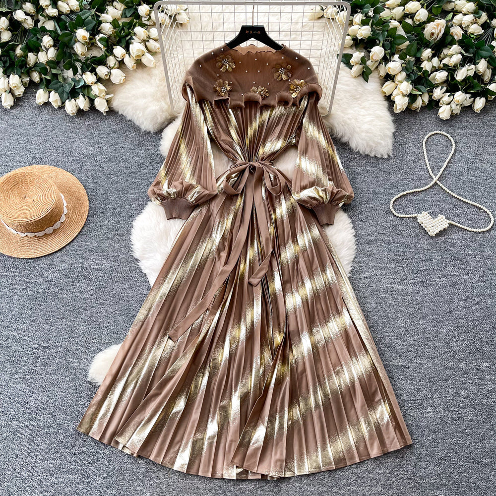 Heavy-duty beaded and gold-stamped lantern sleeve a-line dress for women, perfect for spring. features a cinched waist for a slimming effect, elegant and subtly luxurious design, and a full, flowing skirt
