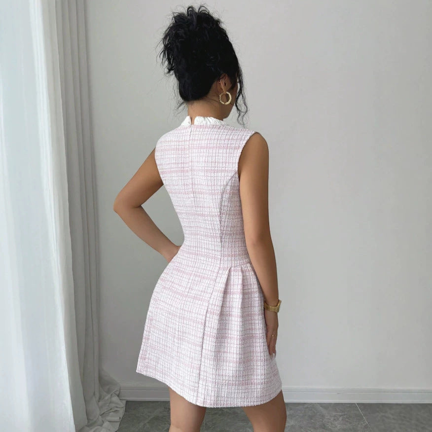 european and american new style pink sleeveless chanel-inspired dress with bow, stand collar, pearl buttons, cinched waist, and a-line silhouette