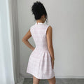 european and american new style pink sleeveless chanel-inspired dress with bow, stand collar, pearl buttons, cinched waist, and a-line silhouette