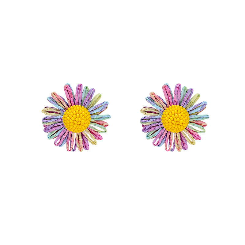 Milky soft, woven raffia daisy flower earrings for women. statement beach earrings designed to flatter the face with a touch of high-end elegance